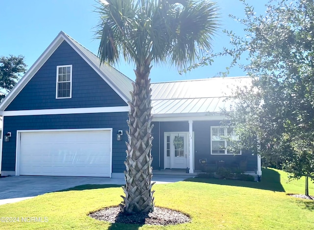 view of front facade featuring a garage and a front yard