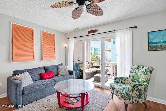 113 Scallop Ln, Carolina Beach, NC 28428 - living area with wood finished floors, a ceiling fan, and a textured ceiling