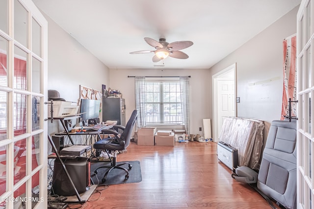 office area with ceiling fan and hardwood / wood-style floors