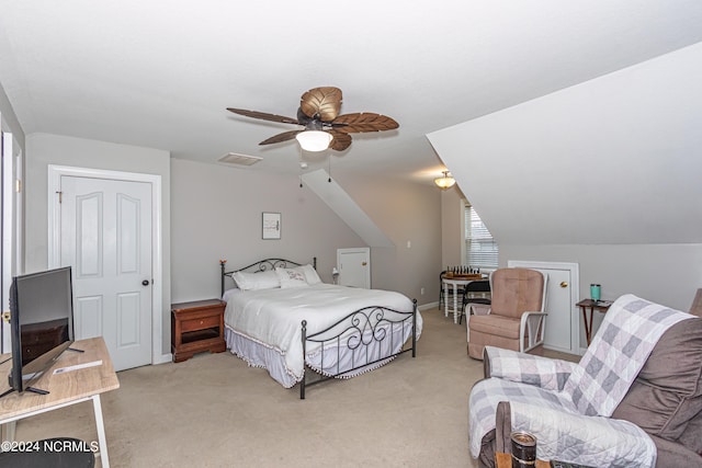 bedroom with light carpet, lofted ceiling, and ceiling fan