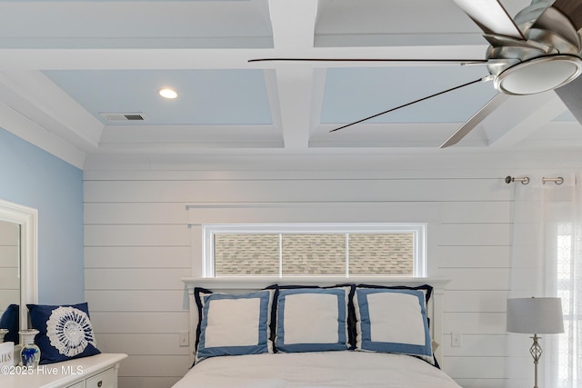 bedroom with beam ceiling, visible vents, multiple windows, and coffered ceiling