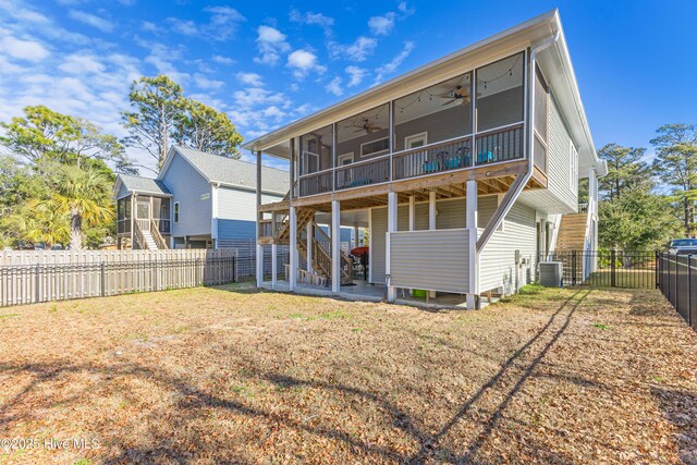 back of property featuring stairs, a patio, a sunroom, and ceiling fan