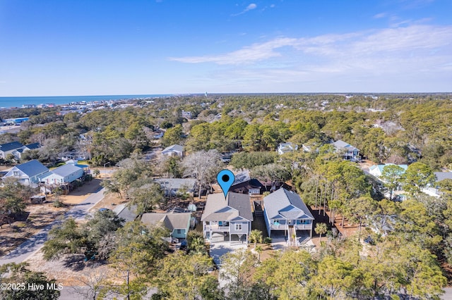 drone / aerial view with a water view and a residential view