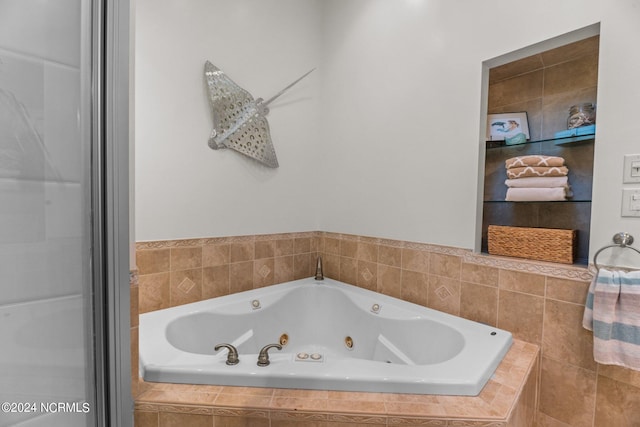 bathroom with tiled tub