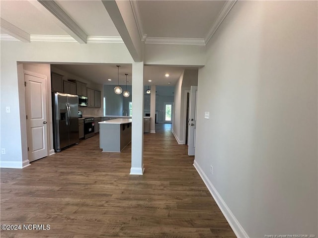 kitchen with a kitchen bar, a kitchen island, dark wood-type flooring, and stainless steel appliances