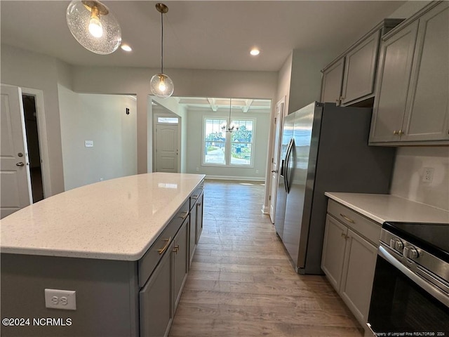 kitchen featuring gray cabinets, light hardwood / wood-style floors, and a kitchen island