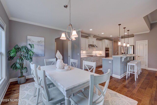 8711 Compass Pointe W Wynd Wynd NE, Leland, NC 28451 - dining area with crown molding, recessed lighting, dark wood-style flooring, and baseboards