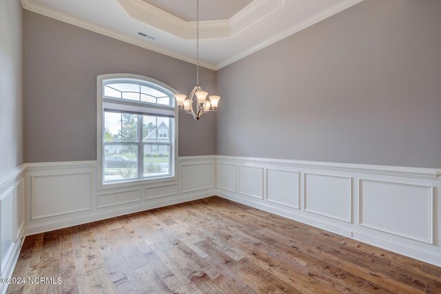 8711 Compass Pointe W Wynd Wynd NE, Leland, NC 28451 - spare room featuring wainscoting, a notable chandelier, wood finished floors, and visible vents