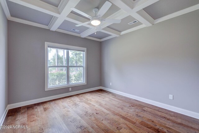 8711 Compass Pointe W Wynd Wynd NE, Leland, NC 28451 - spare room featuring a ceiling fan, visible vents, and coffered ceiling