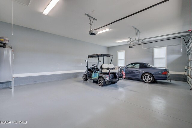 8711 Compass Pointe W Wynd Wynd NE, Leland, NC 28451 - garage with water heater and a garage door opener