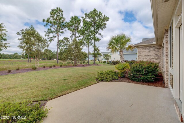 8711 Compass Pointe W Wynd Wynd NE, Leland, NC 28451 - view of yard featuring a patio