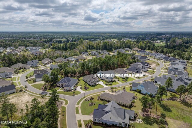 8711 Compass Pointe W Wynd Wynd NE, Leland, NC 28451 - birds eye view of property featuring a residential view