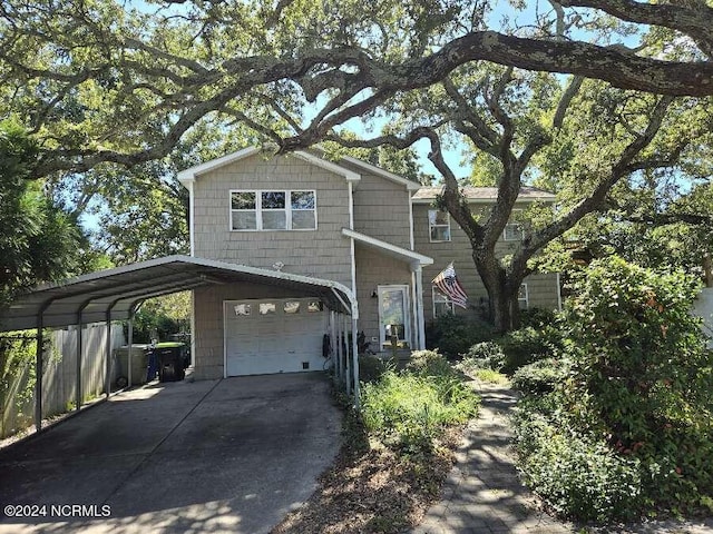 view of front of house featuring a carport and a garage