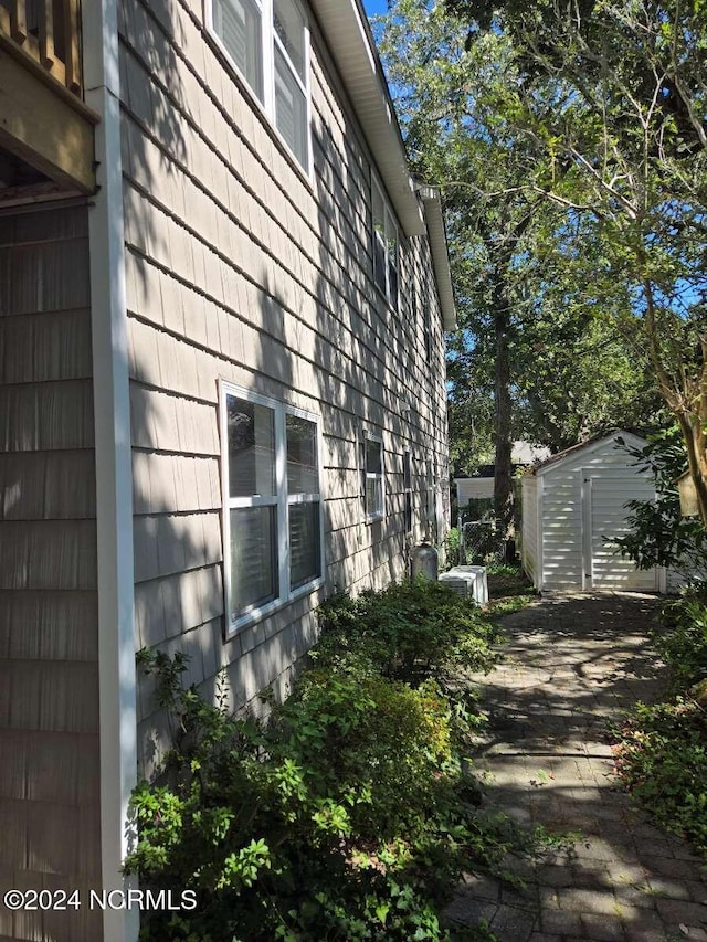 view of home's exterior with a shed