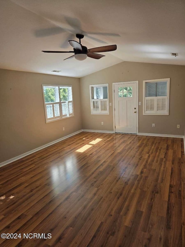 entryway with vaulted ceiling, ceiling fan, and dark hardwood / wood-style floors