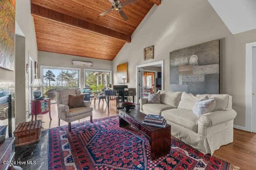 living room with hardwood / wood-style floors, wooden ceiling, high vaulted ceiling, ceiling fan, and beam ceiling