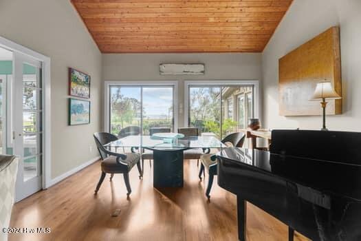 dining room featuring french doors, lofted ceiling, light hardwood / wood-style floors, and wooden ceiling