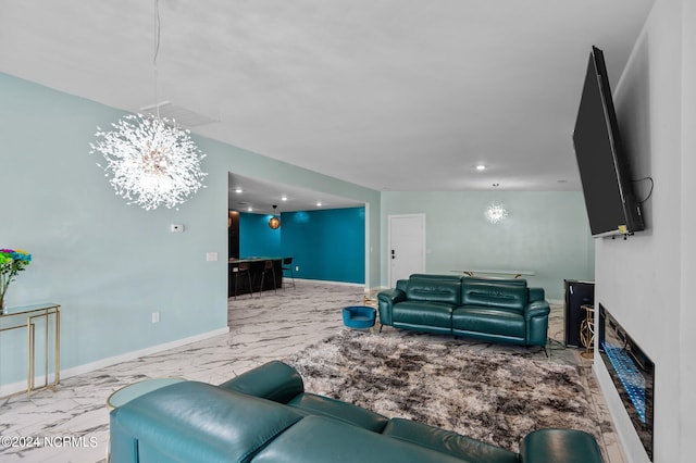 living room featuring a notable chandelier