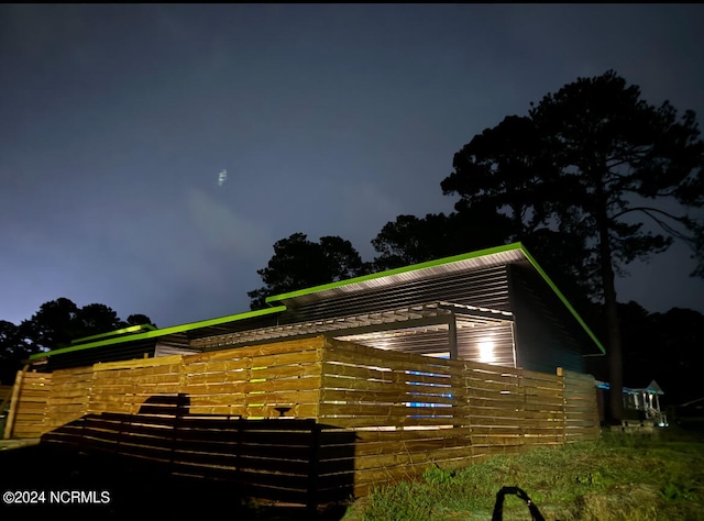 view of property exterior at twilight