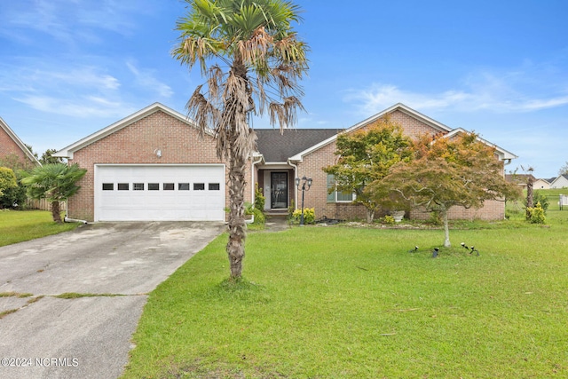 view of front of property with a front lawn and a garage