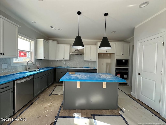 kitchen featuring gray cabinetry, a center island, dishwasher, oven, and pendant lighting