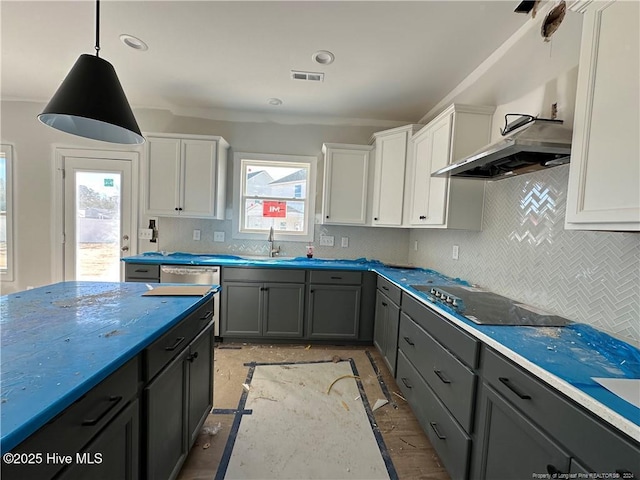 kitchen with white cabinetry, hanging light fixtures, wall chimney range hood, gray cabinets, and black electric stovetop