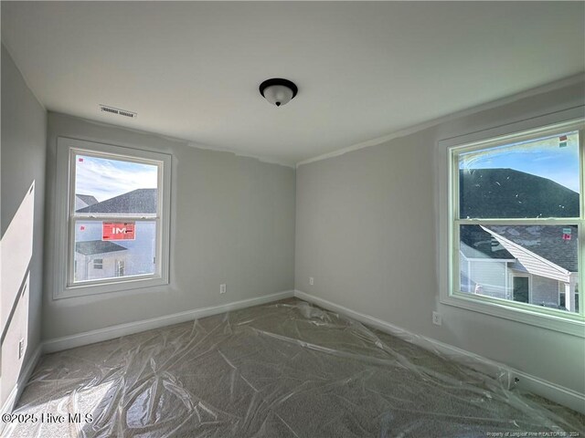 empty room with carpet flooring