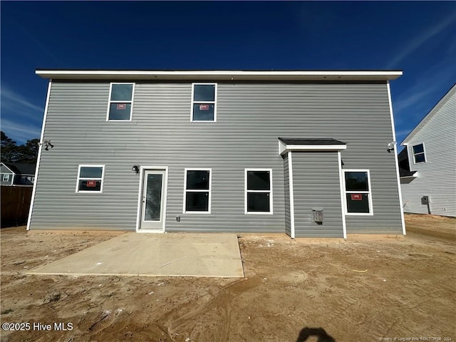 rear view of house featuring a patio