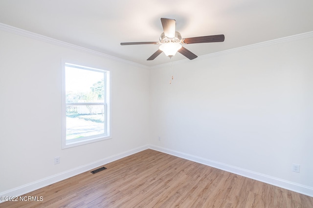 unfurnished room with ceiling fan, light hardwood / wood-style flooring, and ornamental molding