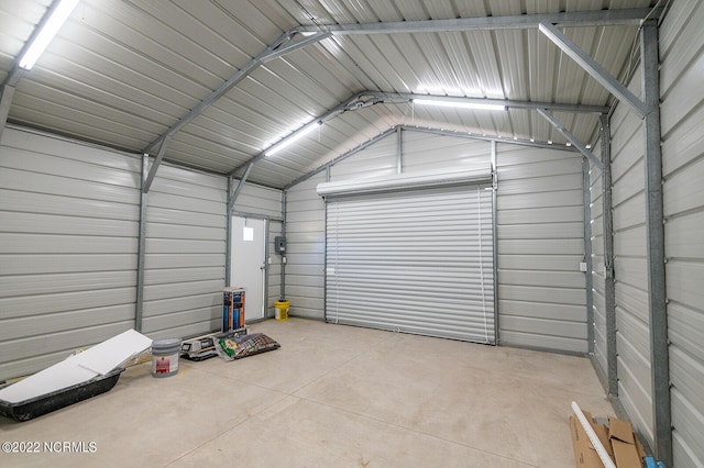 garage featuring wood walls