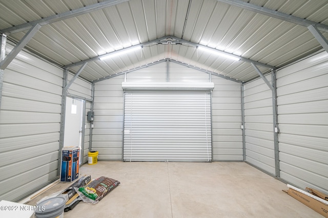 garage featuring wood walls