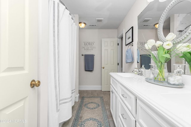 bathroom with vanity and tile patterned floors