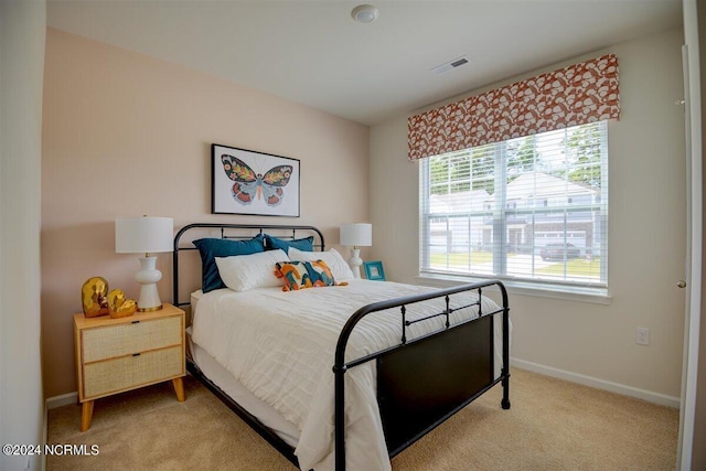 bedroom with light colored carpet