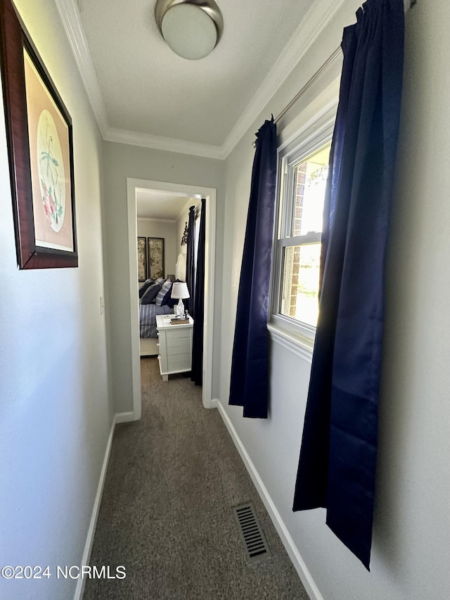 hall featuring crown molding and carpet