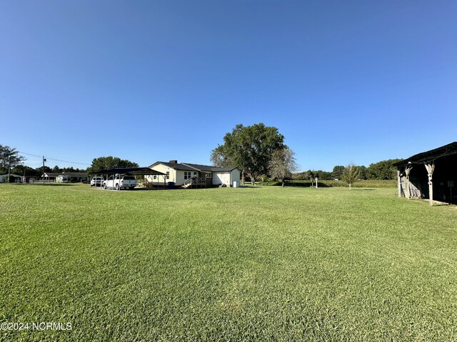 view of yard with a carport