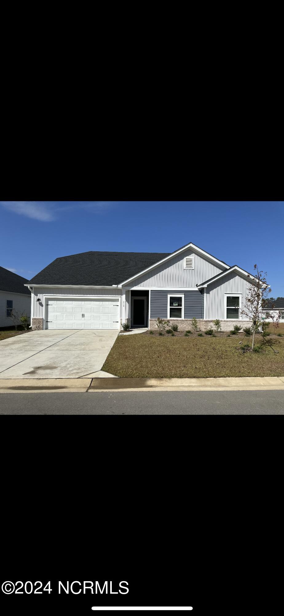 616 Blackthorne Cir NW, Calabash, NC 28467 - view of front of house featuring driveway and a garage