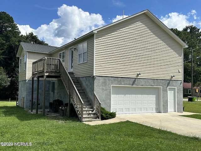 exterior space with a garage, a deck, and a lawn