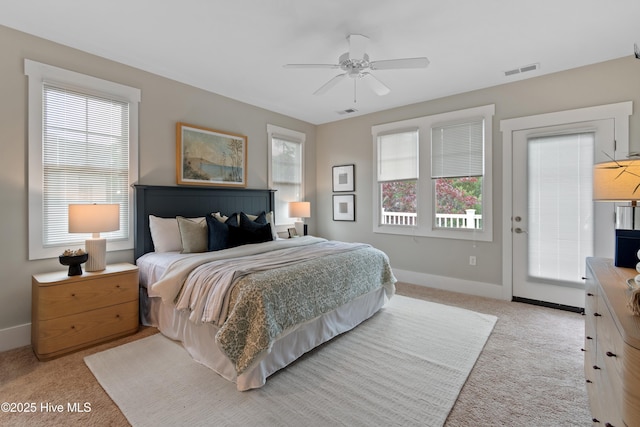 2537 St James Dr SE Unit 303, Southport, NC 28461 - carpeted bedroom with baseboards, ceiling fan, and access to exterior