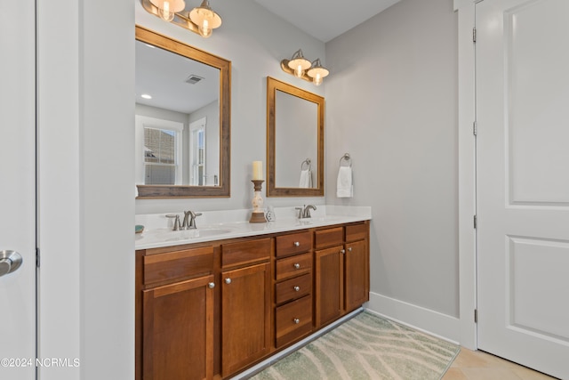 bathroom featuring tile patterned flooring and vanity