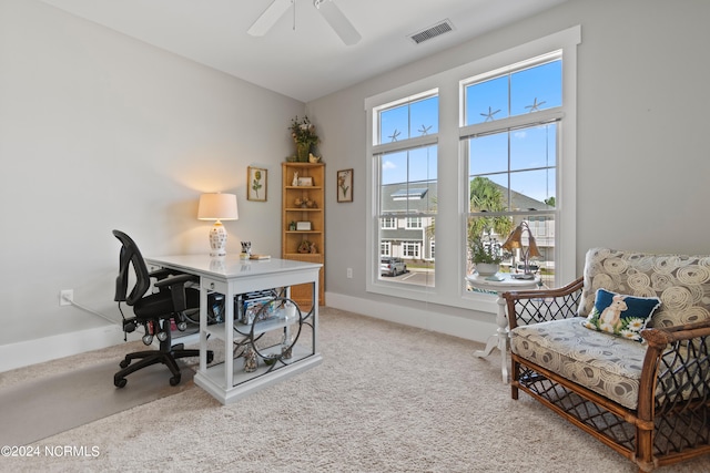 carpeted home office with ceiling fan