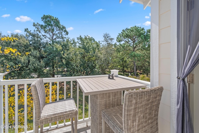 2537 St James Dr SE Unit 303, Southport, NC 28461 - balcony with view of scattered trees