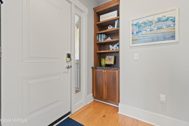 2537 St James Dr SE Unit 303, Southport, NC 28461 - entryway featuring light wood-type flooring and baseboards