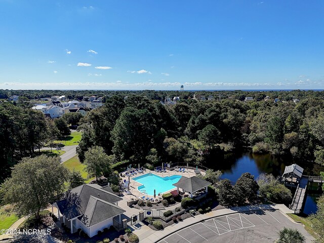 2537 St James Dr SE Unit 303, Southport, NC 28461 - drone / aerial view of a pool and a nearby body of water