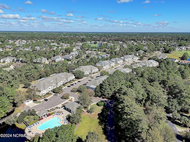 2537 St James Dr SE Unit 303, Southport, NC 28461 - aerial overview of property's location with a pool area and nearby suburban area