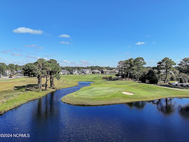 2537 St James Dr SE Unit 303, Southport, NC 28461 - view of home's community featuring a water view, golf course view, and an area to practice putting