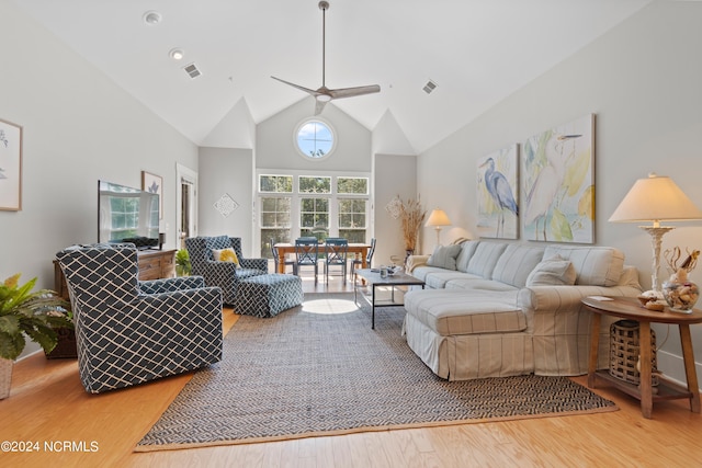 living room featuring high vaulted ceiling, ceiling fan, and hardwood / wood-style floors