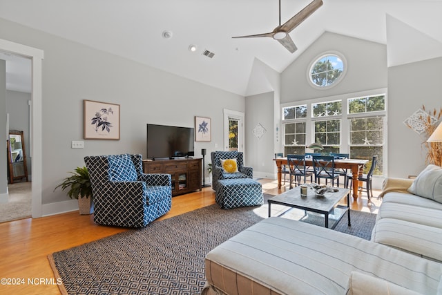 living room featuring high vaulted ceiling, wood-type flooring, and ceiling fan