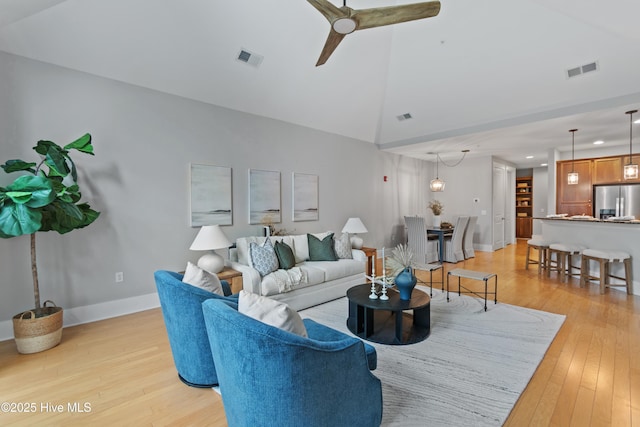 2537 St James Dr SE Unit 303, Southport, NC 28461 - living room featuring a ceiling fan, light wood finished floors, recessed lighting, high vaulted ceiling, and baseboards