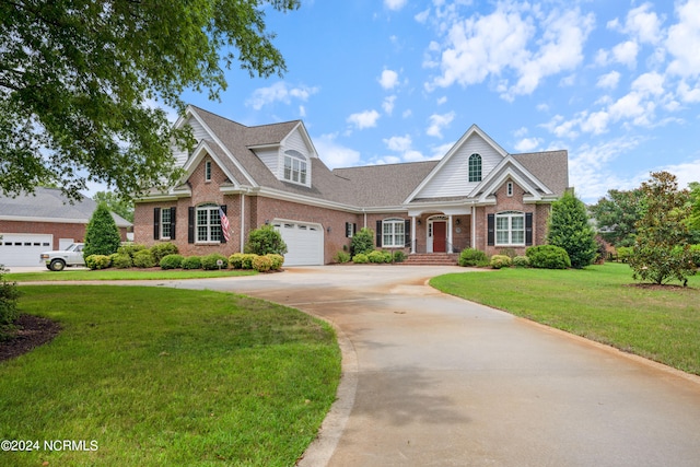 view of front of house with a front lawn and a garage