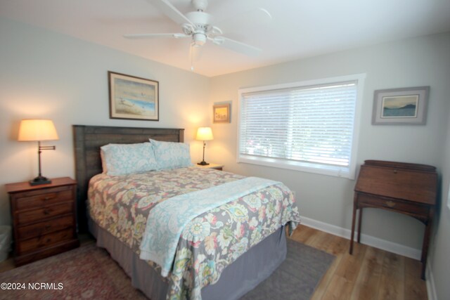 bedroom featuring ceiling fan and wood-type flooring